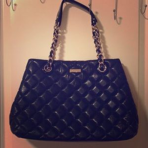Black kate spade quilted purse with gold accents